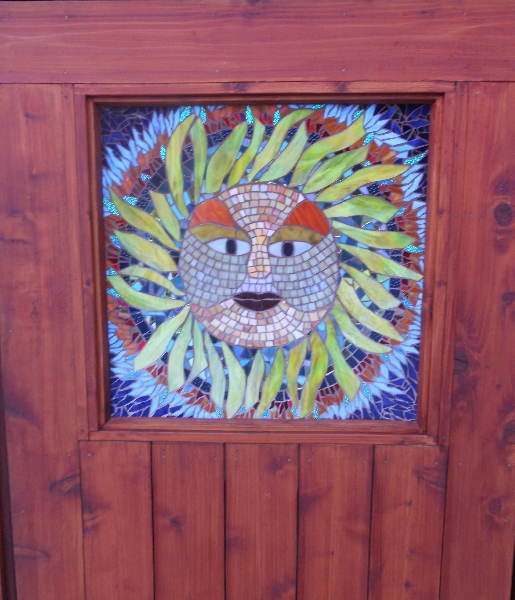 Sun God installed in door