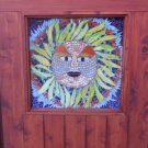 Sun God installed in door